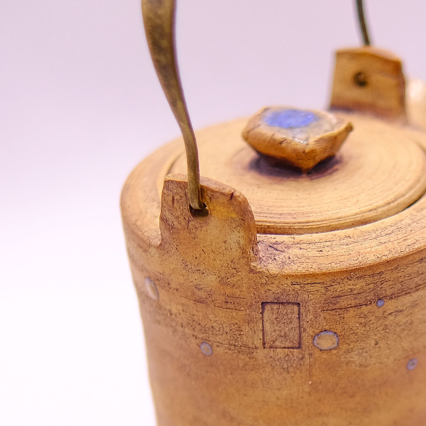 Rustic teapot with metal handle